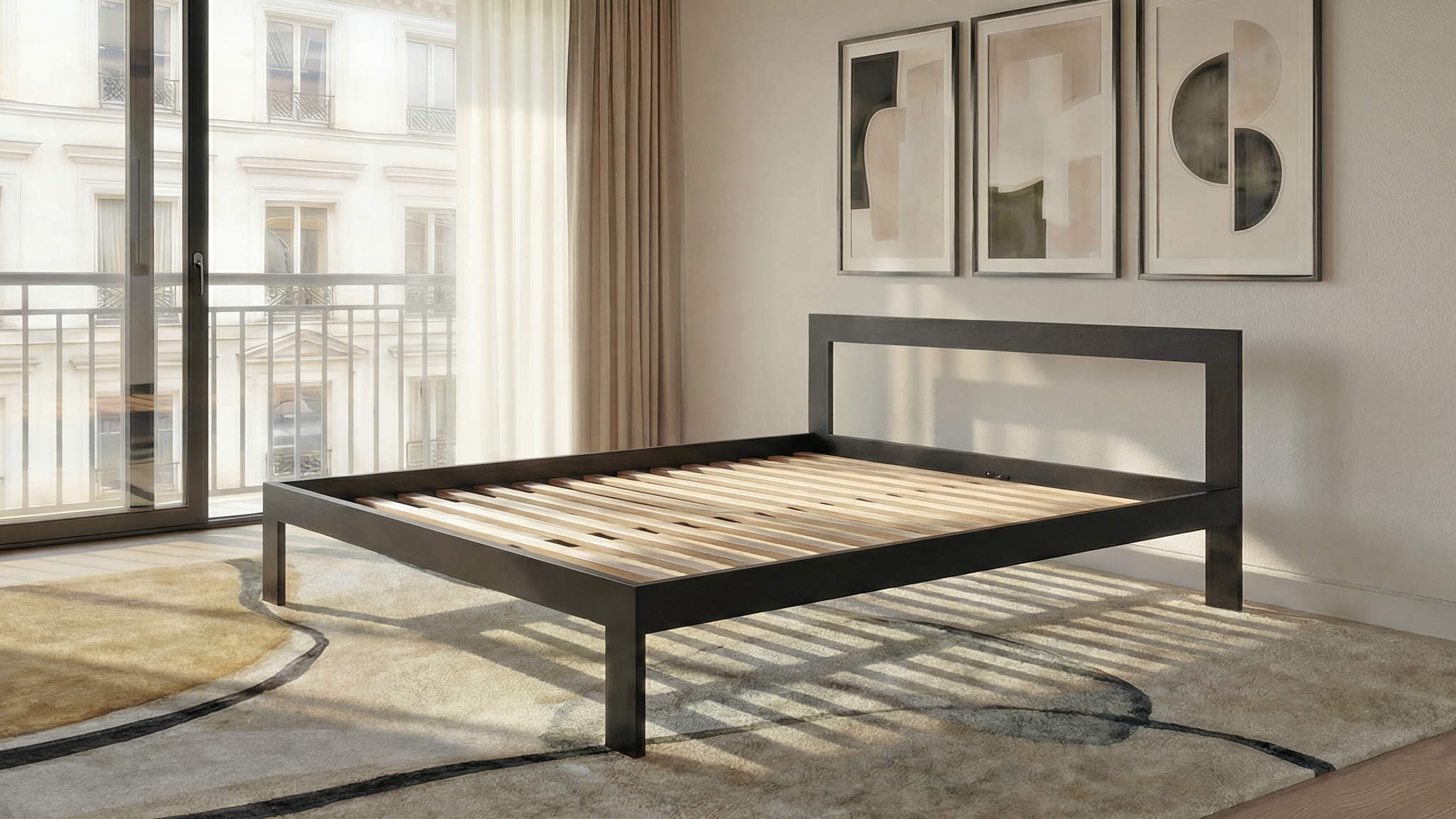 Modern bedroom with a black metal bed frame, abstract art on the wall, and large windows.